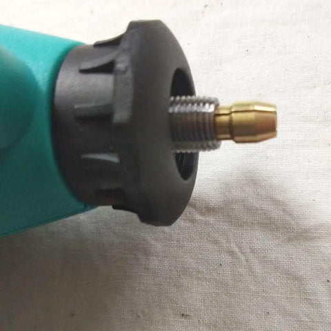 Close-up of tool with Five Piece Copper Drill Chuck Collet Bits Set 1mm For Dremel Rotary Tools, attached to a rotary tool.