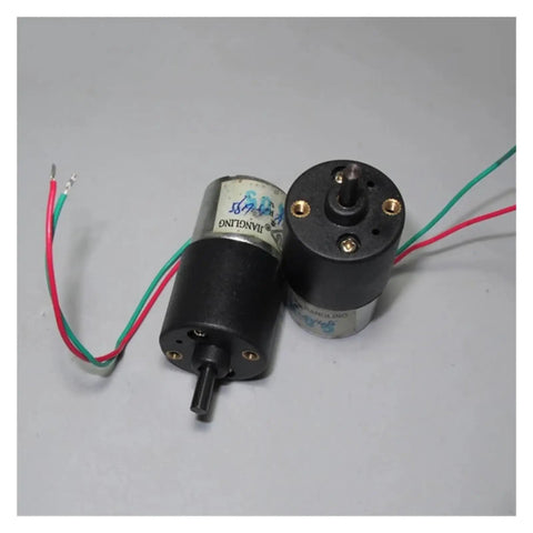 Top Quality DC Planetary Gearbox Speed Reducer Motor Pulling A Steady 14 To 28 Rpm Spin with wires mounted on a grey surface.