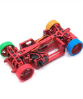 Red RC car chassis with colorful wheels showcasing RC Tire Skin Wrap For 22mm And 22.5mm Wheels, 1/28 Scale RC Cars.