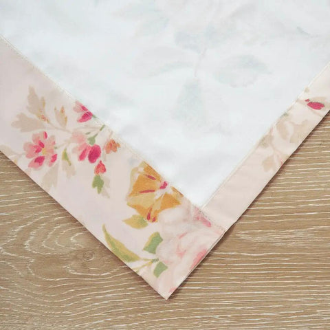 Close-up of Buttercup Floral Curtain Panel Set fabric with floral design and lining, 2 pack, window curtains, cozy home vibe.
