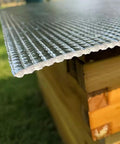 Close-up of Five Pack Thickened Aluminum Reflective Insulation Film For Beehives Waterproof Moisture Proof Sunshade on wooden hive