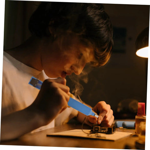 Person using Two Piece Manual Desoldering Pump Solder Removal Tool Suction Gun For PCB Durable Solder Sucker Compact Desoldering Aid