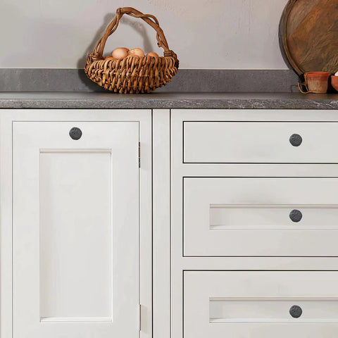 Set of 10 Rustic 1-1/2 Inch Black Iron Cabinet Knobs, installed on white kitchen cabinets, showing vintage farmhouse style