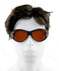 Mannequin wearing OD 6 Plus Laser Safety Specs For 190nm To 550nm Wavelengths, black frame, clear orange lenses.