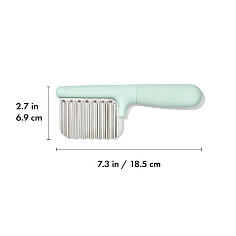 OXO Tot crinkle cutter for kids with mint green handle and stainless steel blade.