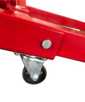 Close-up of wheel on Top Shelf Folding Hydraulic Engine Hoist With Telescopic Boom 2 Ton Capacity Muscle Power Motor Crane.