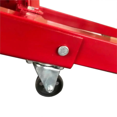 Close-up of wheel on Top Shelf Folding Hydraulic Engine Hoist With Telescopic Boom 2 Ton Capacity Muscle Power Motor Crane.