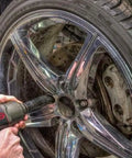 Mechanic using Deep Half Inch Drive Impact Socket Set 6 Point SAE 19 Piece Off Corner Loading Design on car wheel
