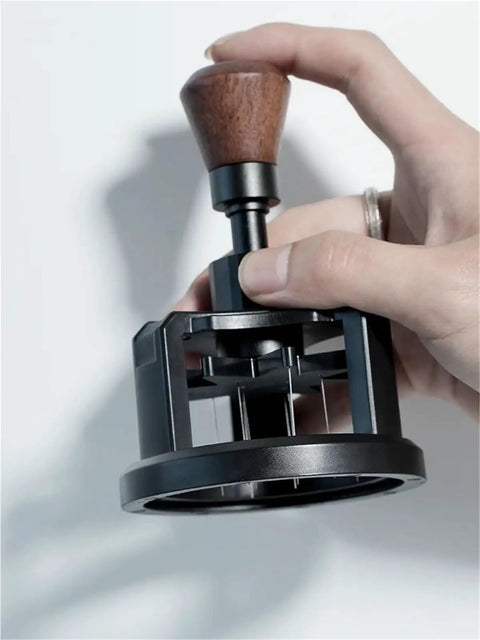 Hit The Mark Every Time With This Rock Solid 58mm Magnetic Stirrer For Espresso Portafilter Featuring Rotary Needle Distributor To Flatten Coffee Beds Smoothly And Elevate Your Home Brewing Game, held from above.