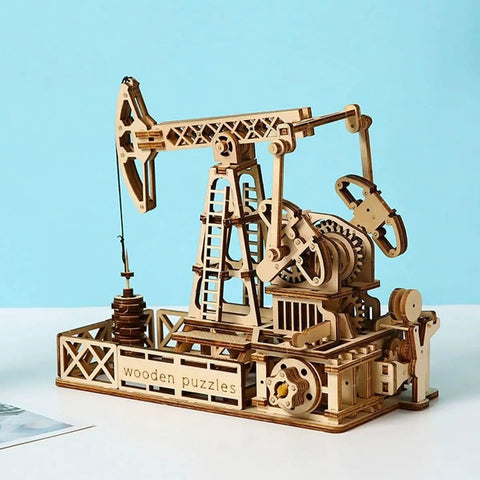 3D Wooden Oil Derrick Model Kit For Adults on blue background, showcasing intricate mechanical engineering details.