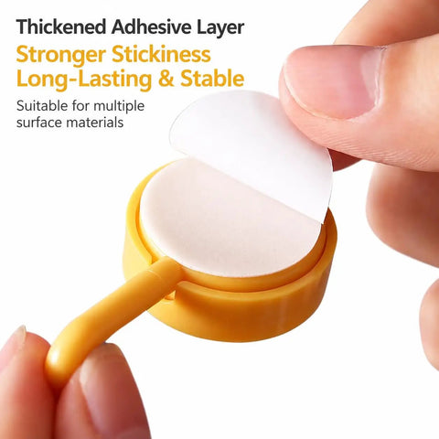 Sixteen Pack Dead Easy Colorful Adhesive Wall Hooks Self Stick Strong Tape No Drill Renter Friendly Low Key Decorative Style quick mount adhesive layer being peeled off.