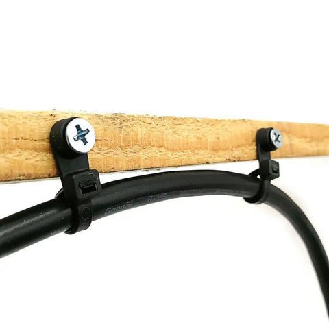 Installed Heavy Duty 7.5 Inch Zip Ties with Mounting Screw Holes securing cable to wood, UV Resistant Nylon 66, 50 Lbs Tensile, 100 Pack