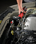 User operating Heavy Duty M12 Three Eighth Drive Cordless Ratchet Battery Operated Power Tool under vehicle hood.