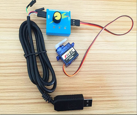 Feetech FS90R 360° micro servo with blue tester module and USB cable on wood surface