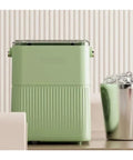 Badass Countertop Ice Maker With Hella Large Storage Producing Fully Automatic Round Cubes in green color on a countertop.