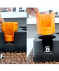 Matte Black Coffee Tamping Station With Knock Box Powder Organizer For Espresso Prep showing an orange powder organizer insert.