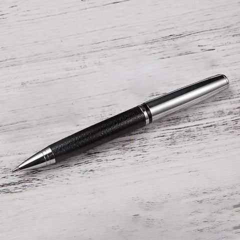 Rotary 0.5mm Ballpoint Pen Set With Leather Grip, Metal Body And Smooth Gel Ink, placed on wooden surface