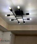 Eight Light Sputnik Chandelier In Oil Rubbed Bronze, Vintage Mid Century Semi Flush Mount Ceiling Fixture, illuminated view.