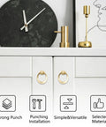 Sleek Round Pull Swing Ring Cabinet Handles 12 Pack made from solid zinc alloy with brushed gold finish on white cabinet