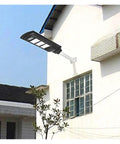Badass 350W Solar Floodlight With Radar Human Body Induction Dusk To Dawn IP67 Waterproof LED Outdoor Security Light mounted on a wall.