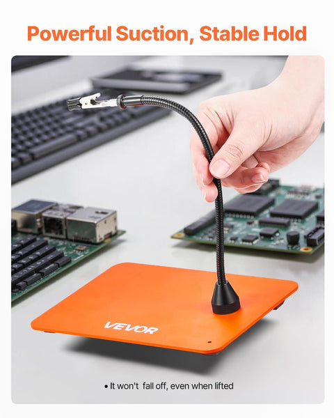 Magnetic Helping Hands Soldering Station with Gooseneck arm holding PCB, non-slip orange steel base, hands free electronics repair tool.