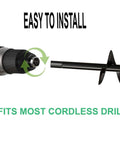 Auger drill bit for planting attached to a cordless drill; black metal spiral auger