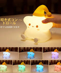 Cute Stars Night Light For Baby Nursery, Color Changing Silicone Star Lamp with yellow hat, shown in 7 different colors.