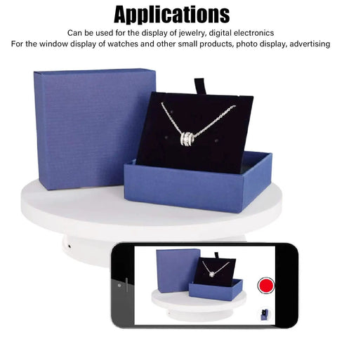 Heavy Duty Rotating Display Stand With White Plug In Remote Motorized Electric Turntable For 360 Degree Photography And Video Shoots showcasing jewelry in blue box.