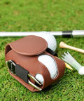 Premium Leather Golf Ball Pouch With Tee Holder Mini Pocket Belt Bag Clip On Waist Storage on grass with golf ball and tees