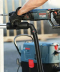 Worker using Reconditioned Bulldog Xtreme 1-Inch SDS-Plus D-Handle Rotary Hammer With Variable Speed, 7.5 Amp on concrete wall