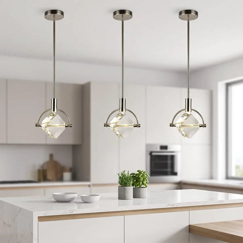 Lamparko Small Pendant Light Fixture with Crystal Cube, Brushed Nickel hanging above a modern kitchen island with plants.