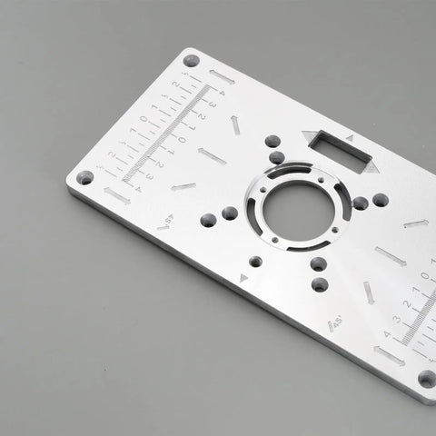 Pro Grade Heavy Gauge Aluminum Router Table Insert Plate With Four Quick Swap Rings And Secure Mount Screws For Woodworking Trim Machines showing detailed measurements and mounting holes.
