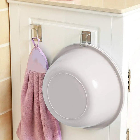 Rock Solid Stainless Steel Bathroom Hook With Tight Suction Mount For Hanging Towels And Scrub Brushes Heavy Duty Wall Organizer securing a purple towel and bowl.