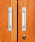 Two aluminum door pull handles on wooden sliding doors, part of Four Pack Aluminum Door Pull Handles For Sliding Doors And Cabinets