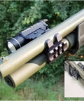 Rugged Shotgun Barrel Clamp Mount With Rubber Pads For 12 Gauge Guns attached to a shotgun with flashlight installed.