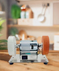 Compact Mini Belt Sander With High Power Motor And Adjustable Speed Options From 3000 To 6000 Rpm on a wooden table.