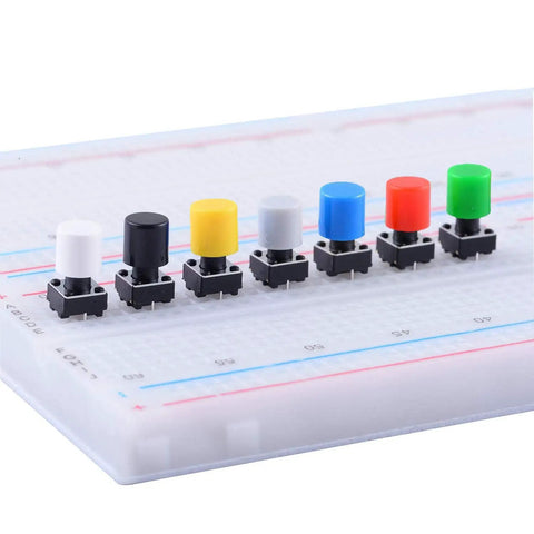 84 Pcs Momentary Tactile Push Button Switch Kit 6x6x8mm With 7 Color Button Caps on a breadboard setup