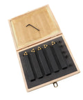 Five-piece carbide turning tool set in an open wooden box with indexable cutters and hex key