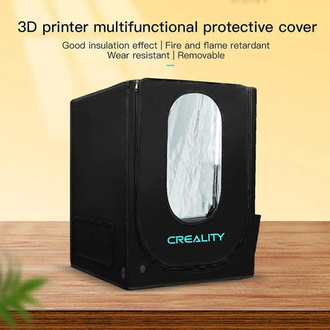 Upgraded 3D Printer Enclosure With LED Lighting And Temperature Control For Ender 3 V2 Ender 3 Pro Ender 5 And CR10S PRO V2 Insulated Fire Retardant Cover, showing black protective cover with clear viewing window on wooden table.