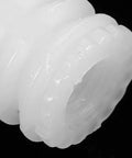 Close-up of a 150 Pcs Plastic Dowel Insert for Cabinet Doors, showing its white plastic material and spiral design.