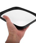 Wide Angle Convex Safety Mirror For Warehouse Parking Garage Driveway Blind Spot Coverage Beat Up Resistant Shell held by hand.