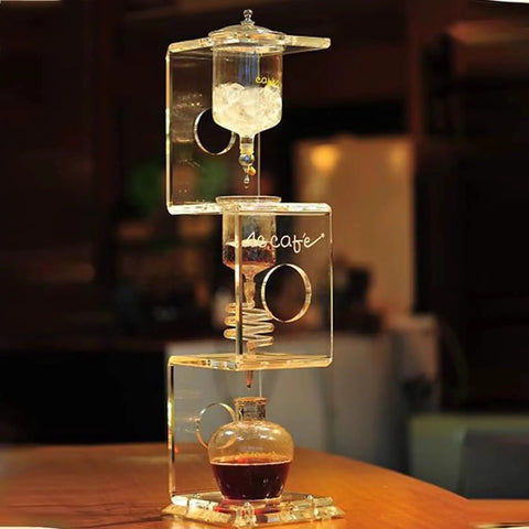 Topnotch Cold Brew Coffee Maker With Slow Drip Ice Tank And Large Capacity Glass Carafe On Solid Wood Base for smooth home coffee brewing.