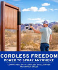 Professional Grade Drill Powered Paint Sprayer in use, spraying a wood fence outdoors, demonstrating cordless capability.