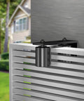 Close-up of Heavy Duty Gate Roller Kit with 3 Inch Black L Shaped Bracket mounted on metal gate outdoors