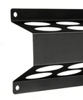 Close-up of metal wall-mounted welding storage rack with open slot design for welding rods