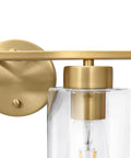 Close-up of Two Light Brass Gold Bathroom Vanity Lights Over Mirror With Glass Shades Modern Curved Wall Sconce Fixtures