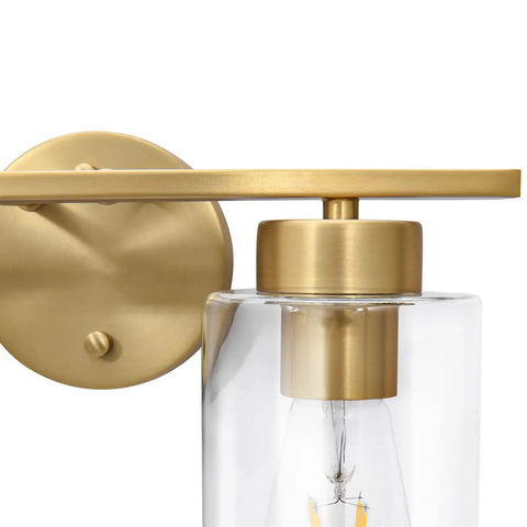 Close-up of Two Light Brass Gold Bathroom Vanity Lights Over Mirror With Glass Shades Modern Curved Wall Sconce Fixtures