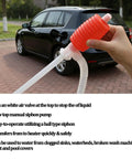 Heavy Duty Manual Hand Siphon Pump, High Flow Portable Fuel Extraction Hose For Gasoline Diesel And Motor Oil in use with car.