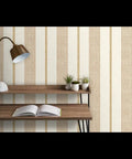 Rich Cream And Modern Gold Vinyl Wallcovering Boasts Subtle Leather Texture For Commercial Grade Heavy Duty Wear And Gets Custom Printed Just For You To Spark A Major Room Glow Up Today on a wooden shelf with a lamp and plants.