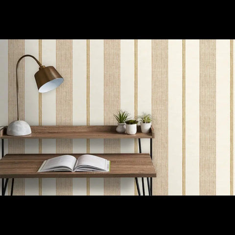 Level Up Your Space With Cream Modern Gold Matte Linen Wallpaper Game Changer PVC Free Durable Wall Covering Pro Grade Paste To Paper Design For Living Areas, showcased with a wooden shelf and lamp.